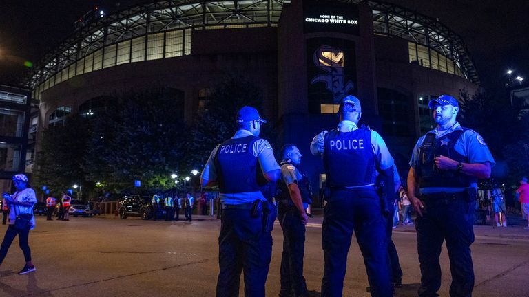 Chicago police officers stand outside Guaranteed Rate Field on Friday, Aug. 25, 2023, in Chicago. Police are investigating a shooting at the White Sox&#39;s baseball game at the stadium Friday night. Police said the investigation is ongoing. (Tyler Pasciak LaRiviere/Chicago Sun-Times via AP)