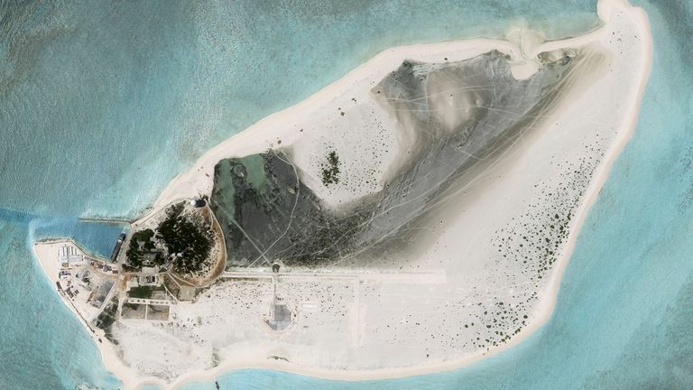 This satellite photo from Planet Labs PBC shows Triton Island in the South China Sea on Tuesday, Aug. 15, 2023. China appears to be constructing an airstrip on a disputed South China Sea island that is also claimed by Vietnam and Taiwan, according to satellite photos analyzed by The Associated Press on Wednesday, Aug. 16, 2023. (Planet Labs PBC via AP)