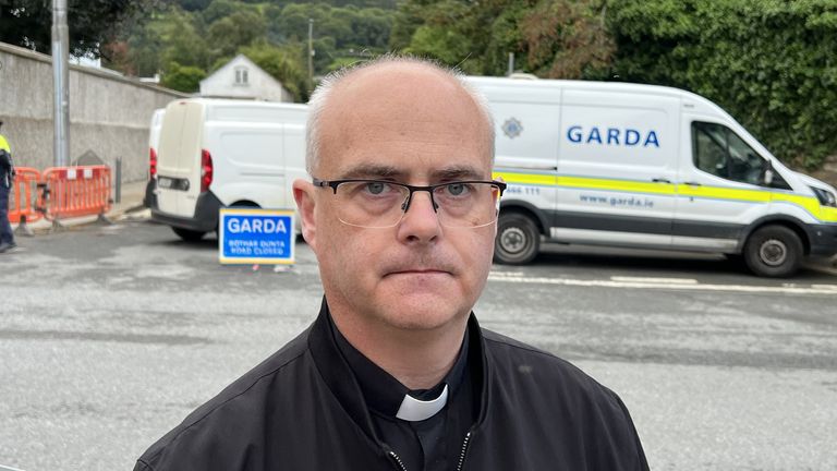 Father Michael Toomey at the scene of the fatal crash 