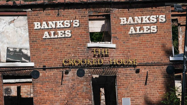 The burnt out remains of The Crooked House pub near Dudley. A fire gutted the 18th century pub just days after it was sold to a private buyer. Firefighters and police were called to the pub in Himley, West Midlands, at 10.45pm on Saturday. The blaze was extinguished and no-one was reported to have been injured, Staffordshire Police said. Picture date: Monday August 7, 2023.