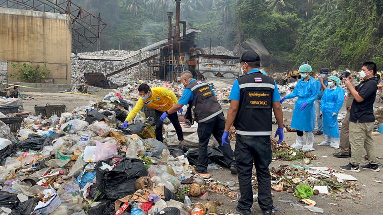 Thai police forensic officers investigate a landfill. Pic: AP