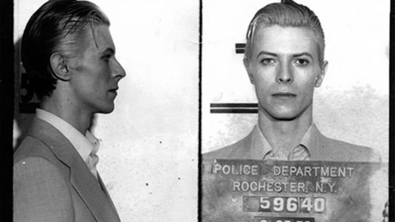 David Bowie mugshot after he was arrested along with Iggy Pop and another person following a performance in Rochester, New York on 21 March 1976