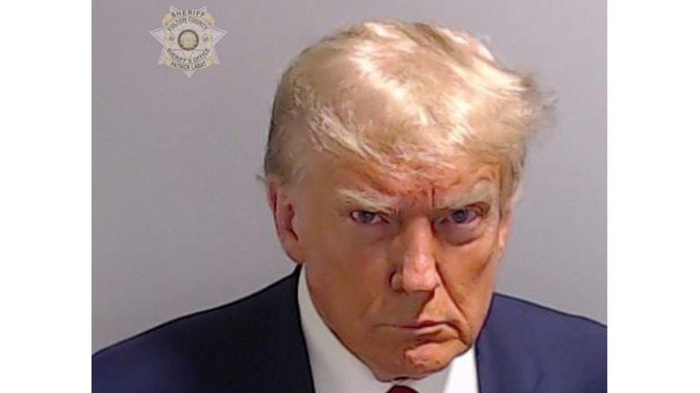 Former U.S. President Donald Trump is shown in a police booking mugshot released by the Fulton County Sheriff&#39;s Office, after a Grand Jury brought back indictments against him and 18 of his allies in their attempt to overturn the state&#39;s 2020 election results in Atlanta, Georgia, U.S., August 24, 2023. Fulton County Sheriff&#39;s Office/Handout via REUTERS  THIS IMAGE HAS BEEN SUPPLIED BY A THIRD PARTY.      TPX IMAGES OF THE DAY     