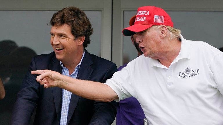 Tucker Carlson with Donald Trump last year. Pic: AP