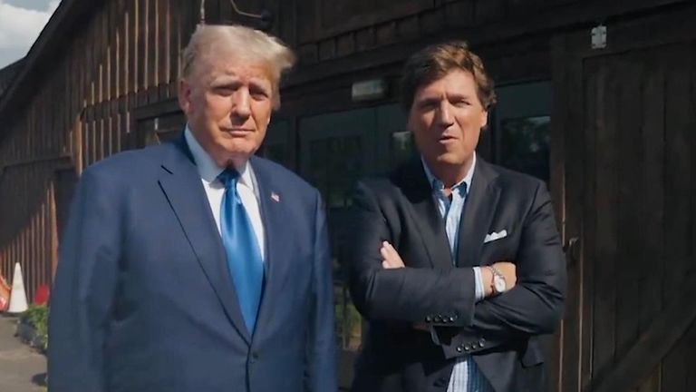Donald Trump and Tucker Carlson pose ahead of their interview on X, formerly known as Twitter