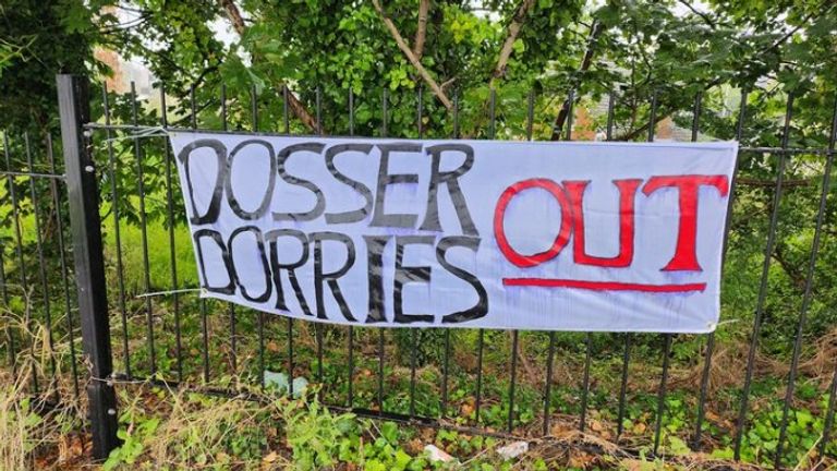 A sign calling for Nadine Dorries to quit hung outside a local train station station. Photo by Jez Darr