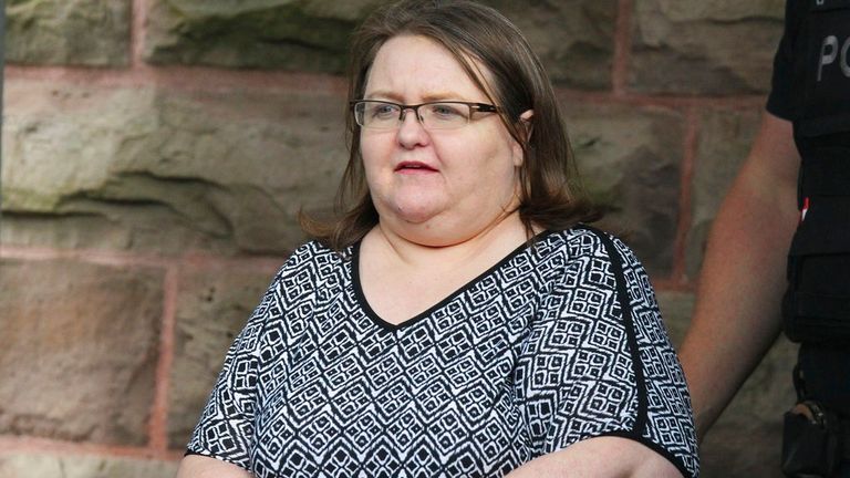 Elizabeth Wettlaufer is escorted by police from the courthouse in Woodstock, Ont, Monday, June 26, 2017. Wettlaufer, a former Ontario nurse who murdered eight seniors in her care, was sentenced Monday to life in prison with no eligibility for parole for 25 years. The 50-year-old pleaded guilty last month to eight counts of first-degree murder, four counts of attempted murder and two counts of aggravated assault. (Dave Chidley/The Canadian Press via AP)



