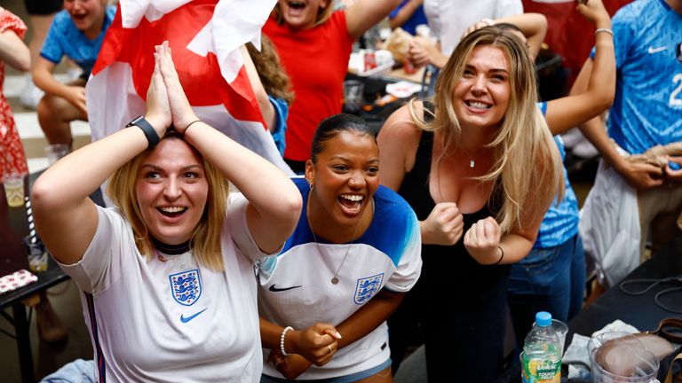 Soccer Football - FIFA Women&#39;s World Cup Australia and New Zealand 2023 - Fans in London gather for Australia v England - BOXPARK Wembley, London, Britain - August 16, 2023 England fans celebrate after Alessia Russo scores their third goal Action Images via Reuters/Peter Cziborra