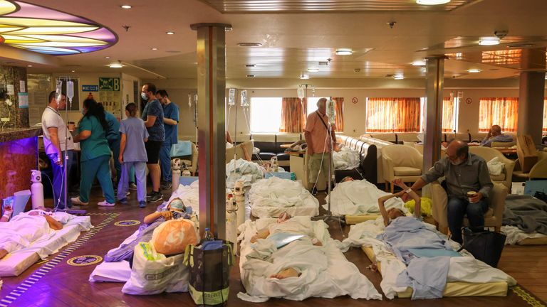 Patients from the General University Hospital of Alexandroupolis are seen inside a ferry after being evacuated, as a wildfire rages in Alexandroupolis, on the region of Evros, Greece, August 22, 2023. REUTERS/Alexandros Avramidis
