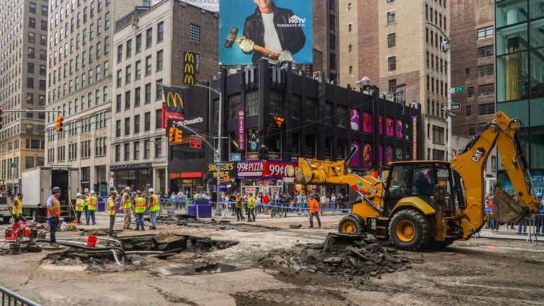 Work crews begin repair after a 127-year-old water main under New York&#39;s Times Square gave way under 40th Street and Seventh Avenue at 3 a.m. Pic: AP