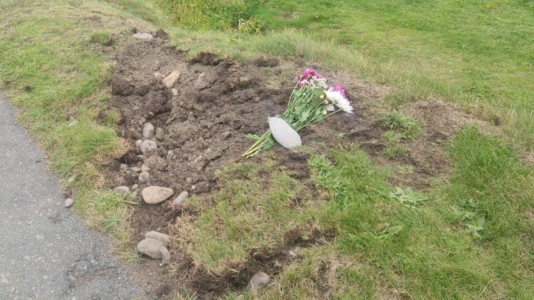 Flowers appear to have been laid at the scene 