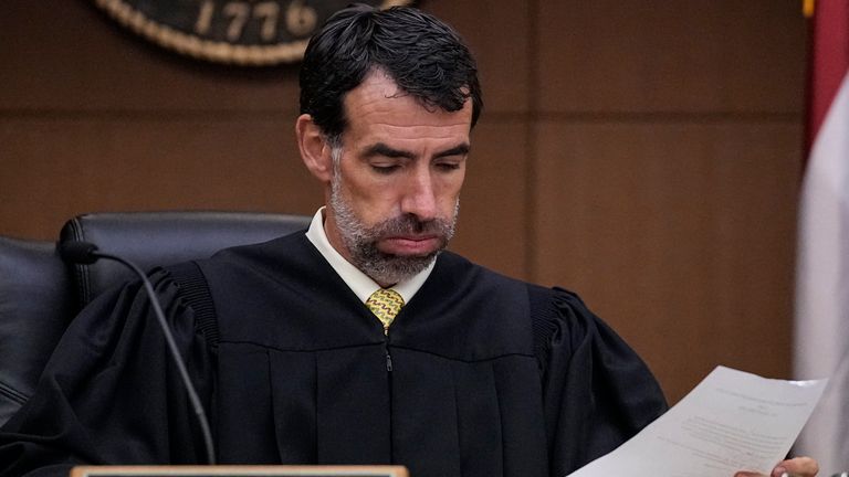 Fulton County Superior Court Judge Robert McBurney looks through the indictment. Pic: AP