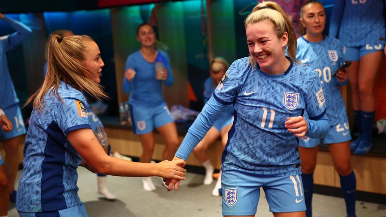 Georgia Stanway, Lauren Hemp and teammates of England celebrate in the dressing room following the win