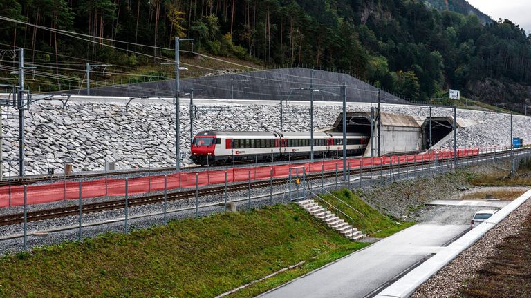 In this image released on Monday, April. 4, 2016, is the north portal of the Gotthard Base Tunnel in Erstfeld, Switzerland. The Gotthard Base Tunnel, the longest train tunnel in the world, enters into service on 11 December 2016. Prior to this, the record-breaking construction will be more accessible than ever, but only for a limited period. From 2 August 2016, passengers may descend into the once-in-a-century construction on exclusive tunnel rides - disembarkation in the depths of the mountain 