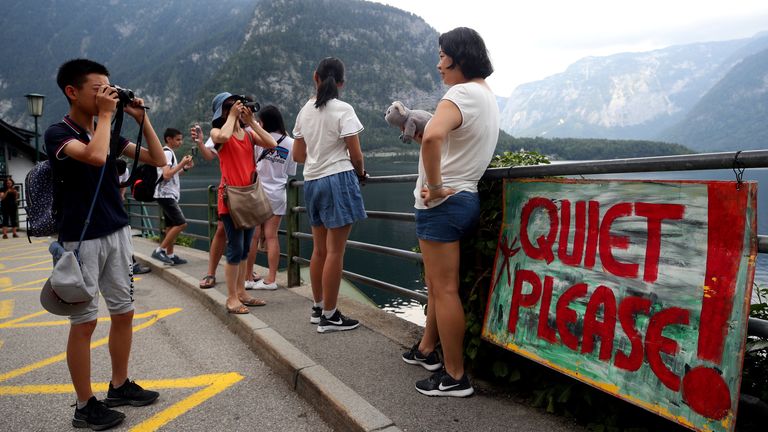 Locals of Austrian village of Hallstatt protest against mass tourism | World News | Sky News