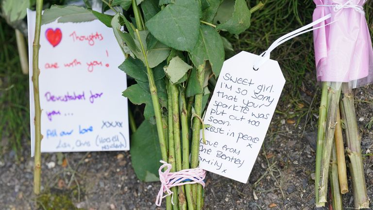 A note left on flowers outside a property on Hammond Road in Woking, Surrey, where a 10-year-old girl was found dead after officers were called to the address on Thursday following a concern for safety. Picture date: Friday August 11, 2023.

