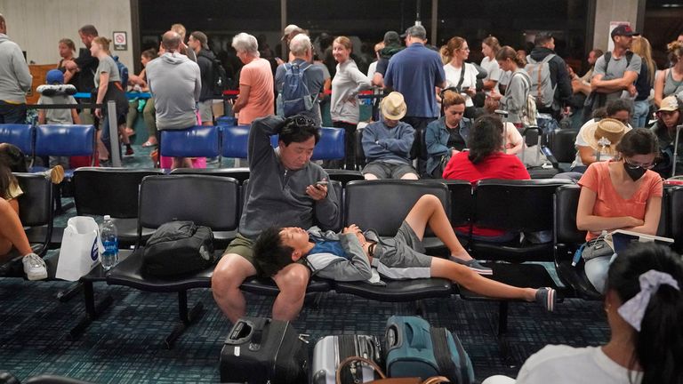 People gather at the Kahului Airport while waiting for flights Wednesday. Pic: AP