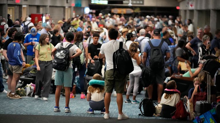 People gather at the Kahului Airport while waiting for flights Wednesday. Pic: AP