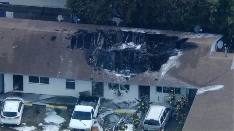 The helicopter crashed into an apartment building. Pic: WPLG-TV