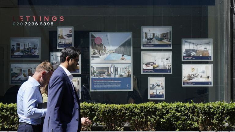 People walk past an estate agents in London.  Picture date: Thursday June 22, 2023.