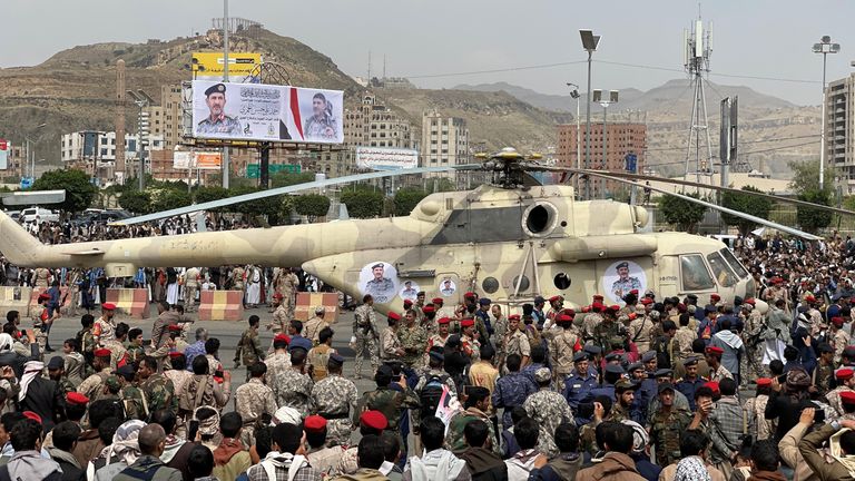 Houthi supporters gather around a military helicopter carrying the coffin of the Houthi commander of Air Force, Ahmad al-Hamzi, following his funeral in Sanaa, Yemen August 8, 2023. REUTERS/Khaled Abdullah