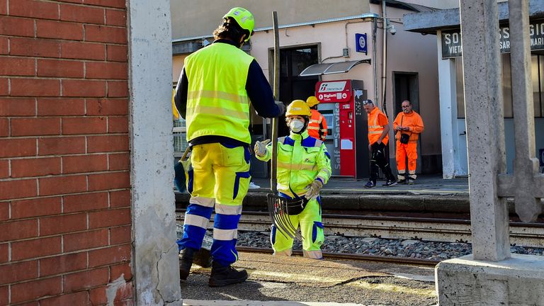 Officials working at the station after the fatal accident