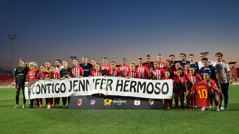Atletico Madrid players and staff hold a banner in support of Spain&#39;s Jennifer Hermoso