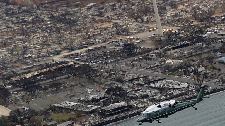 U.S. President Joe Biden, aboard Marine One, inspects the fire-ravaged town of Lahaina on the island of Maui in Hawaii, U.S., August 21, 2023. REUTERS/Kevin Lamarque  