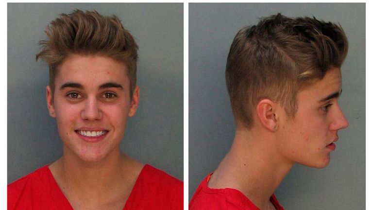 Canadian teen pop singer Justin Bieber is shown in this combo of booking photos provided by the Miami-Dade Corrections and Rehabilitation Department in Miami, Florida January 23, 2014. Bieber was arrested in south Florida early Thursday on a drunk driving charge after he was caught drag racing on a main thoroughfare in a rented yellow Lamborghini sports car, according to police. REUTERS/Miami-Dade Corrections and Rehabilitation Department/Handout via Reuters (UNITED STATES - Tags: ENTERTAINMENT 