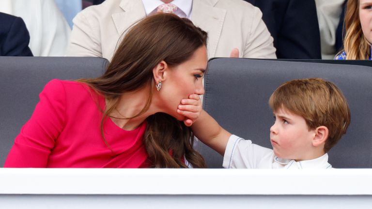 Prince Louis covering his mother the Duchess of Cambridge&#39;s mouth with his hand as they attend the Platinum Pageant. Pic: Max Mumby 