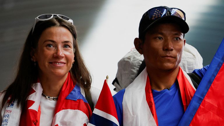 Norwegian mountaineer Kristin Harila, 37, along with Nepali mountaineer Tenjen (Lama) Sherpa, 35, pose for a picture upon their arrival at the airport after becoming the world's fastest climbers to scale all peaks above 8,000 meters in the shortest time, in Kathmandu, Nepal, August 5, 2023. REUTERS/Navesh Chitrakar
