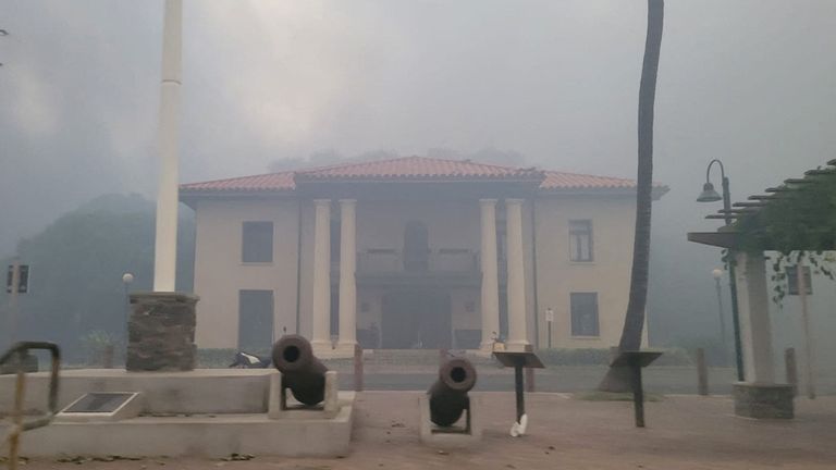 Smoke obscures the old Lahaina courthouse as wildfires driven by high winds destroy a large part of the historic town of Lahaina, Hawaii, U.S. August 9, 2023. Dustin Johnson/Handout via REUTERS THIS IMAGE HAS BEEN SUPPLIED BY A THIRD PARTY. REFILE - REMOVING KAHULUI
