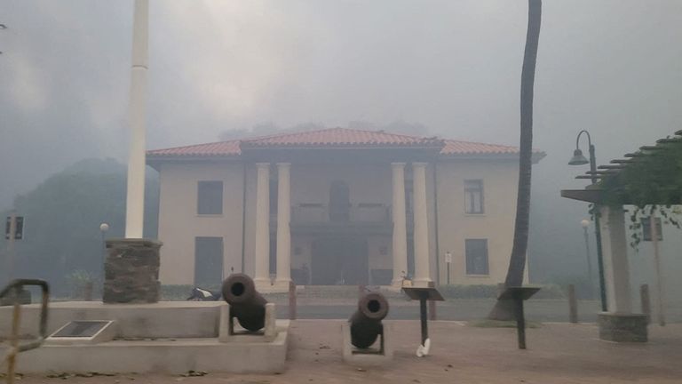 Smoke obscures the old Lahaina courthouse as wildfires driven by high winds destroy a large part of the historic town of Lahaina, Hawaii, U.S. August 9, 2023. Dustin Johnson/Handout via REUTERS THIS IMAGE HAS BEEN SUPPLIED BY A THIRD PARTY. REFILE - REMOVING KAHULUI
