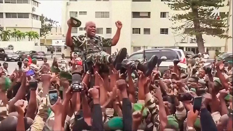 Gabon soldiers hold a general aloft after the coup. Pic: AP