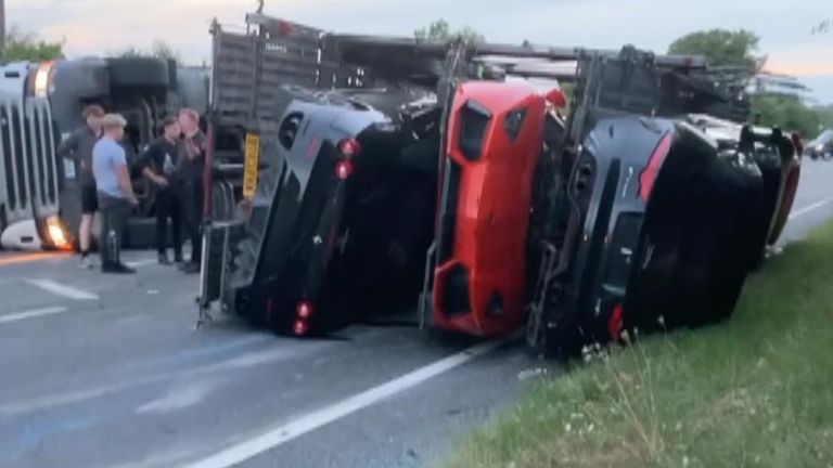 A red Lamborghini Huracan, a black Jaguar F-Type, and an Aston Martin DB11 were among several cars which toppled over in a transporter on the A20. Police say the driver of the transporter sustained a minor injury.