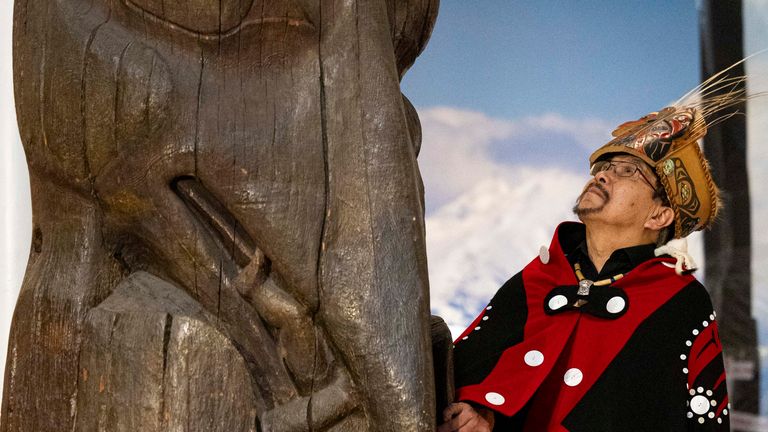 Chief Ni’isjoohl with the Ni’isjoohl Memorial Pole. Pic: Duncan McGlynn
