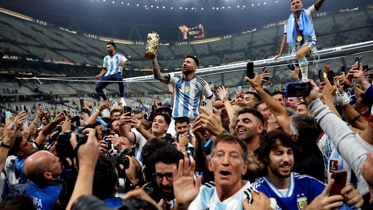 Argentina&#39;s Lionel Messi celebrating with the trophy after winning the World Cup. Pic: Carl Recine
