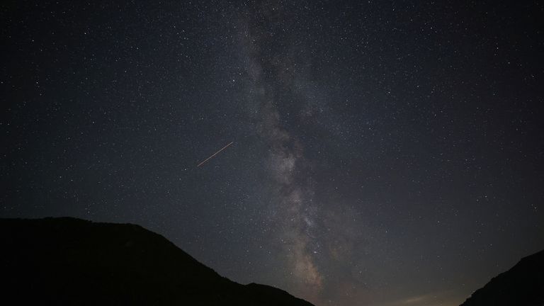 A view of meteor streaks in the night sky during annual Perseid meteor shower at Shebenik National Park, in Fushe Stude, Albania, August 13, 2023.