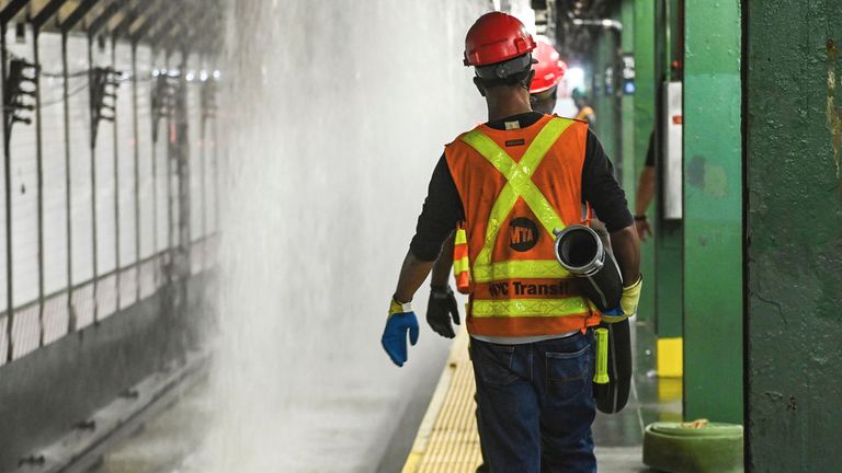 Water from a water main break cascading into New York&#39;s Times Square subway station. Pic: AP
