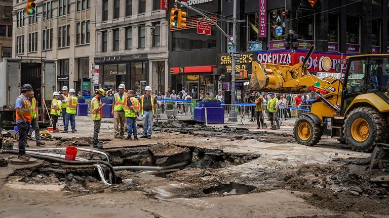 Work crews begin repair after a 127-year-old water main under New York&#39;s Times Square gave way under 40th Street and Seventh Avenue. Pic: AP