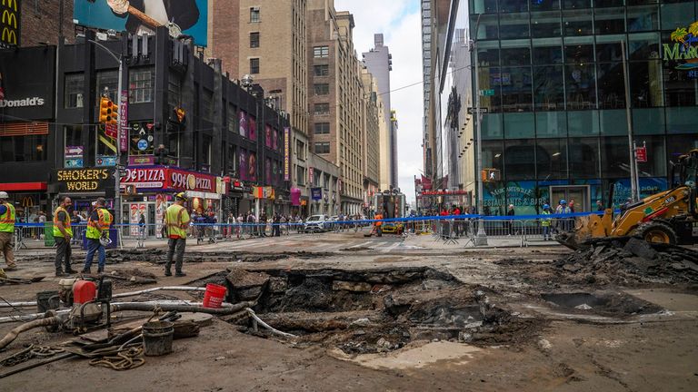 Work crews begin repair after a 127-year-old water main under New York&#39;s Times Square gave way. Pic: AP