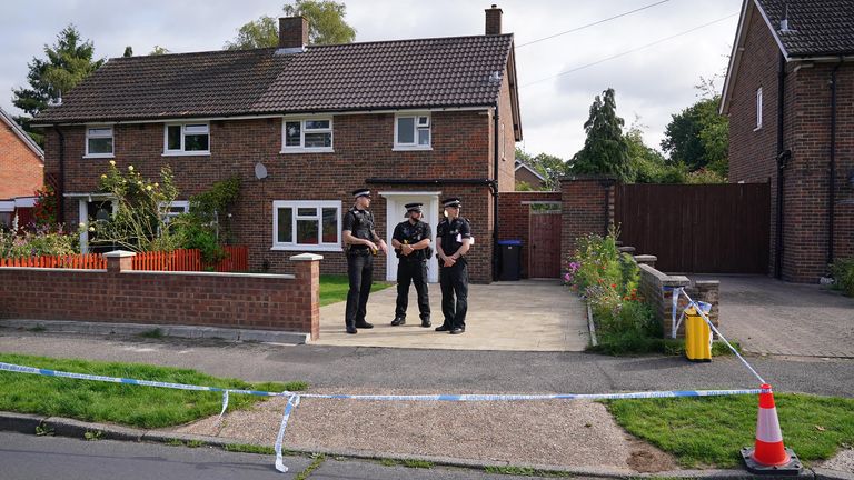 Surrey Police officers outside a property on Hammond Road in Woking, Surrey, where a 10-year-old girl was found dead after officers were called to the address on Thursday following a concern for safety. Picture date: Friday August 11, 2023. PA Photo. See PA story POLICE Woking. Photo credit should read: Jonathan Brady/PA Wire