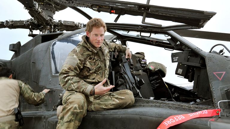 Prince Harry carries out a pre-flight check to his Apache helicopter in Camp Bastion, southern Afghanistan in this photograph taken December 12, 2012, and released January 21, 2013. The Prince, who is serving as a pilot/gunner with 662 Squadron Army Air Corps, is on a posting to Afghanistan that runs from September 2012  to January 2013.  Photograph taken December 12, 2012