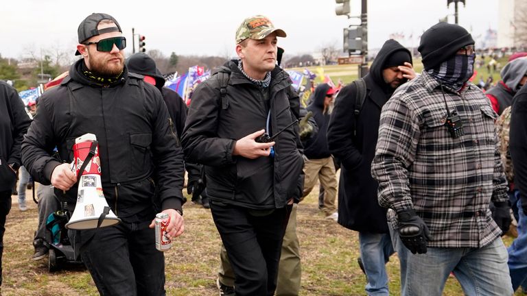 In this Jan. 6, 2021, photo, Proud Boys members Ethan Nordean, left, Zachary Rehl and Joseph Biggs walk toward the U.S. Capitol in Washington, in support of President Donald Trump. Four men described by prosecutors as leaders of the far-right Proud Boys have been indicted on charges that they planned and carried out a coordinated attack on the U.S. Capitol to stop Congress from certifying President Joe Biden&#39;s electoral victory. Nordean and Biggs, two of the four defendants charged in the latest