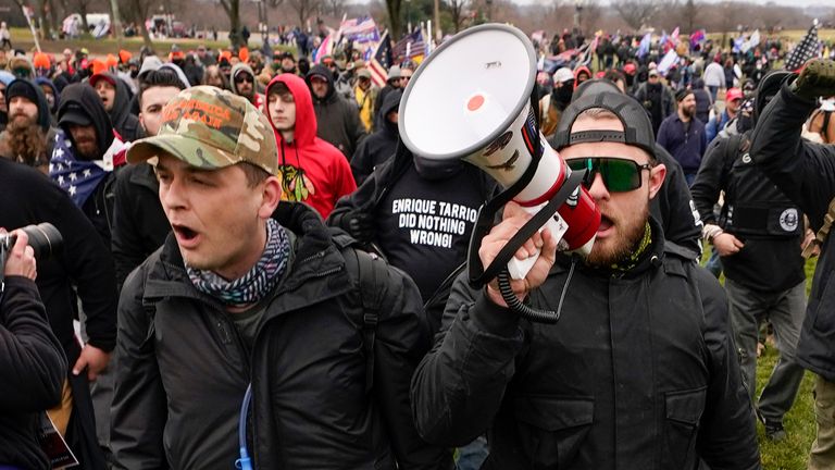 FILE - Proud Boys members Zachary Rehl, left, and Ethan Nordean, right, walk toward the U.S. Capitol in Washington, in support of President Donald Trump on Jan. 6, 2021. Former Proud Boys leader Enrique Tarrio and three other members of the far-right extremist group were convicted Thursday of a plot to attack the U.S. Capitol in a desperate bid to keep Donald Trump in power after the Republican lost the 2020 presidential election. (AP Photo/Carolyn Kaster, File)