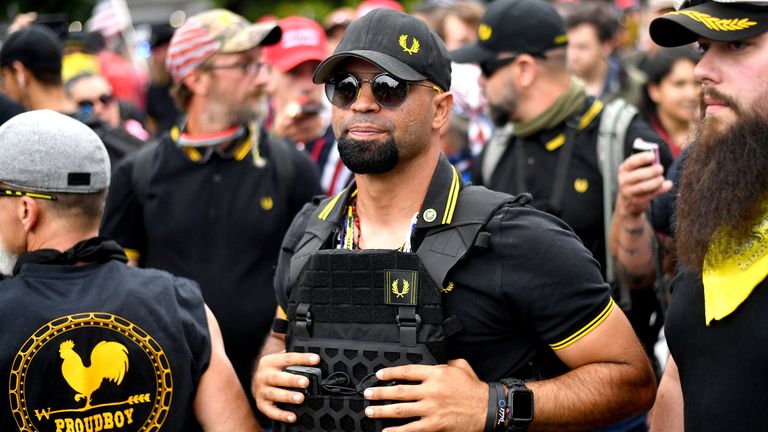 FILE - Proud Boys chairman Enrique Tarrio rallies in Portland, Ore., Aug. 17, 2019. Metropolitan Police Department Lt. Shane Lamond has been arrested on charges that he lied about leaking confidential information to a leader of the far-right Proud Boys extremist group and obstructed an investigation after group members destroyed a Black Lives Matter banner in Washington, D.C. Lamond is scheduled to make his initial court appearance on Friday. (AP Photo/Noah Berger, File)