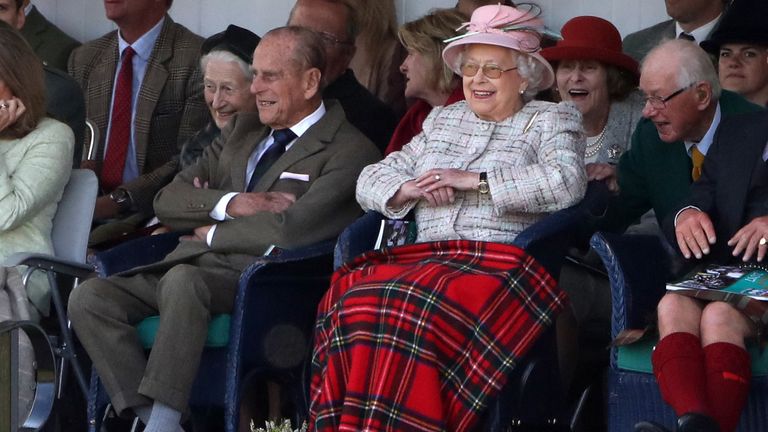 The Duke of Edinburgh and Queen Elizabeth II attend the Braemar Royal Highland Gathering at the Princess Royal and Duke of Fife Memorial Park, Braemar.