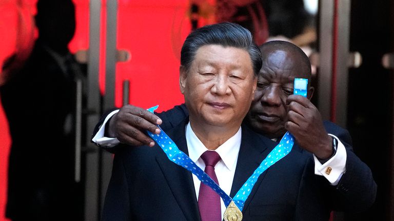 Xi Jinping receives the order of South Africa from President Cyril Ramaphosa at the summit. Pic: AP