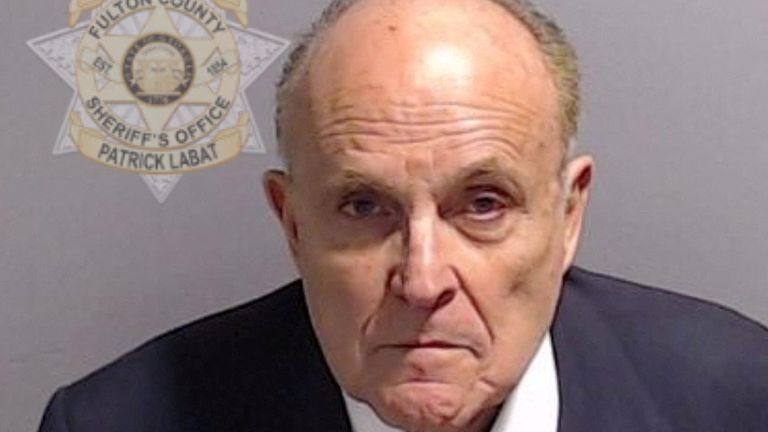 Rudy Giuliani, who served as former U.S. Donald Trump&#39;s personal lawyer, is shown in a police booking mugshot released by the Fulton County Sheriff&#39;s Office 