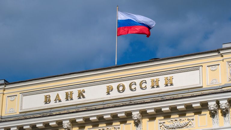 A Russian state flag flies over the Central Bank headquarters in Moscow, Russia May 7, 2023. A sign reads: "Bank of Russia". REUTERS/Shamil Zhumatov